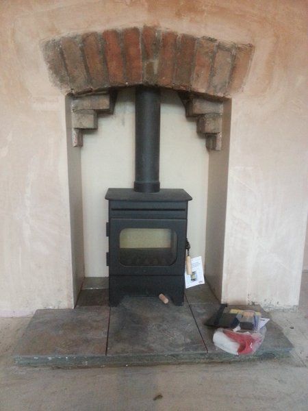 Wood burning stove in a fireplace: detailed how to fit instructions