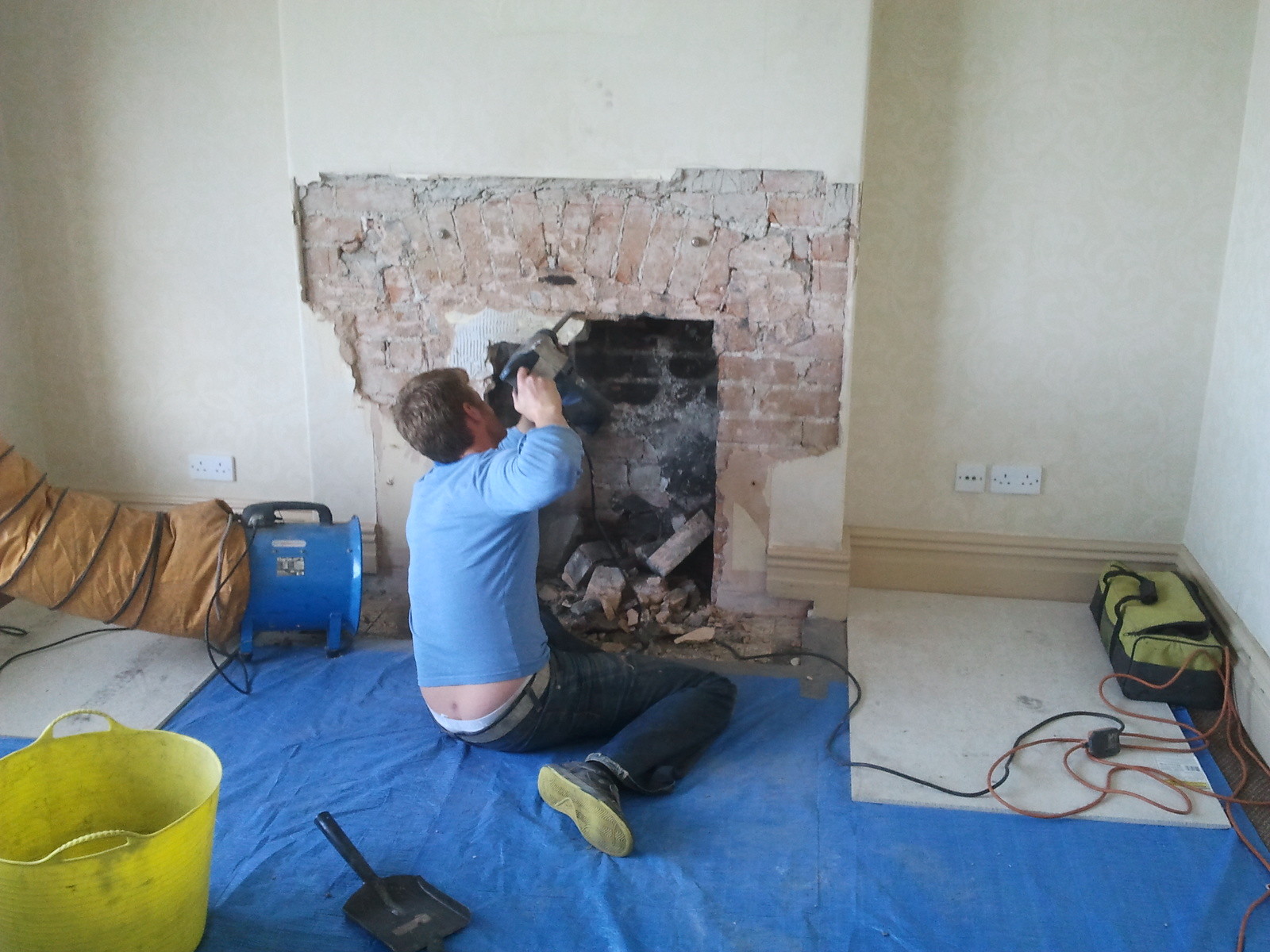 Opening up a fireplace for the installation of a wood burning stove